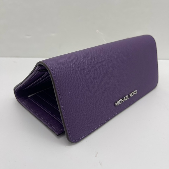 Michael Kors Lg Jet Set Travel Trifold Leather Wallet
Dark Purple
NWT - Picture 8 of 16